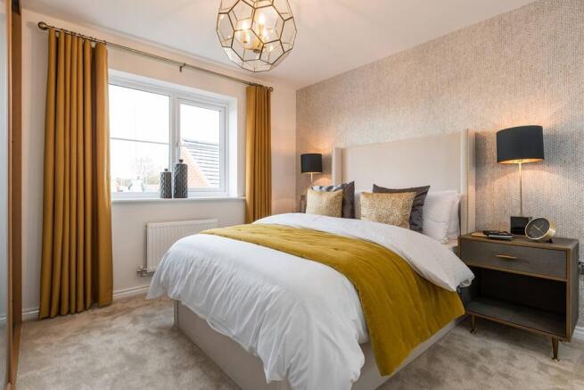 The main bedroom boasts an en suite shower room
