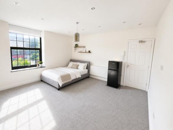 Bright and airy bedroom with modern furnishings...