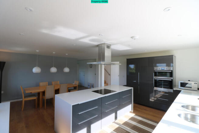 Kitchen with dining area in background