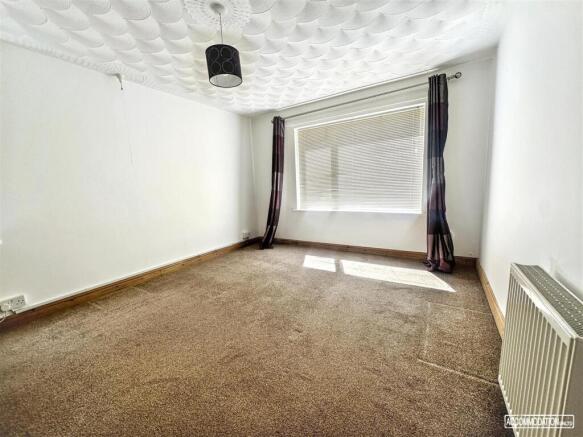 Bright, spacious room with large sunny window...