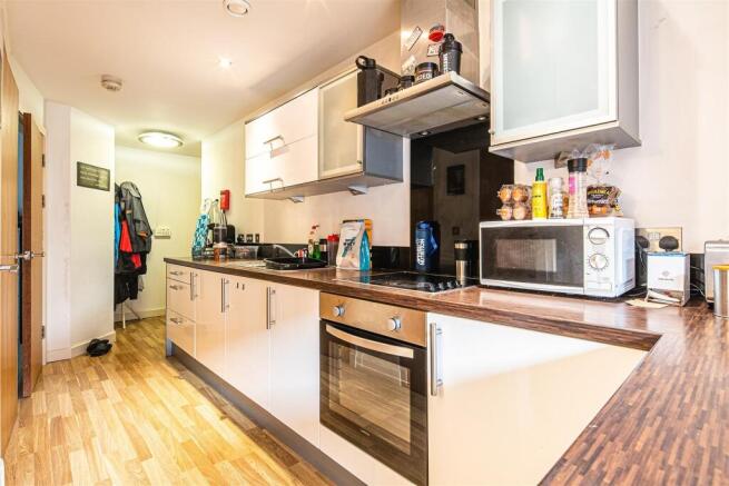 Modern kitchen with sleek units and appliances...