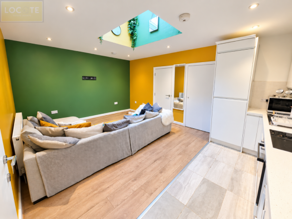 Modern Green and Gold Open-Plan Interior