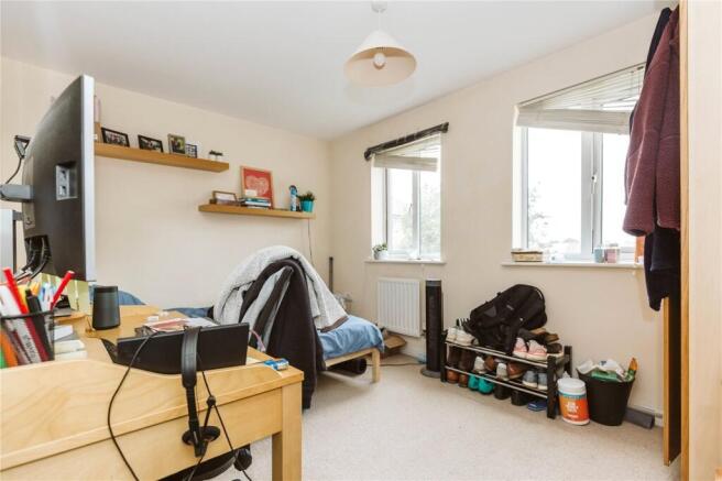 Bright and cozy single bedroom with two windows...