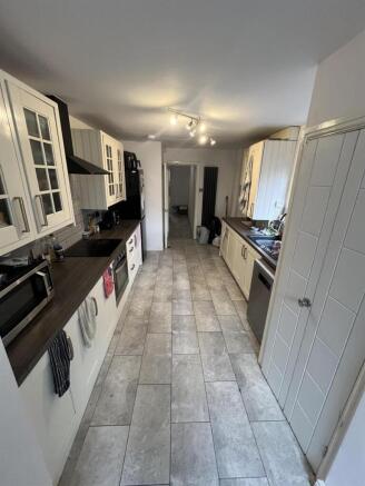 Bright modern galley kitchen with ample storage...