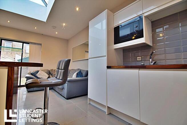 Bright modern kitchen with stylish skylight...