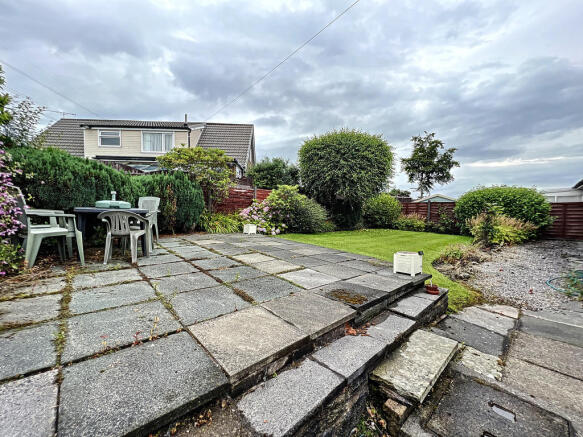 Rear patio and ga...