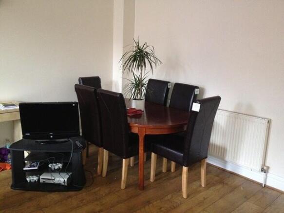 Neat dining set with natural light and woodenfl...