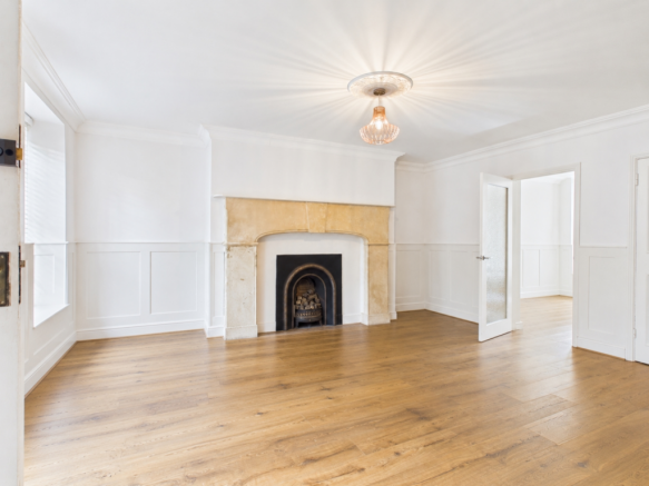 Empty room with preserved architectural details