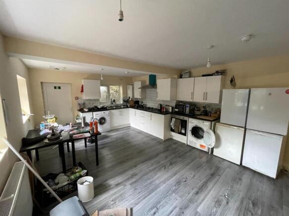 A functional kitchen area featuring white cabin...
