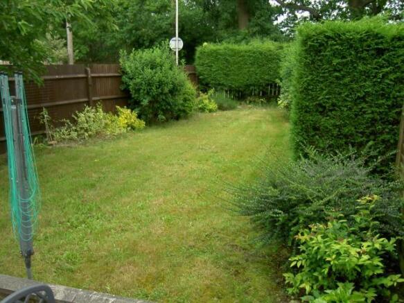 TO THE REAR OF THE PROPERTY
