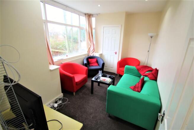 Bright and welcoming living room featuring a va...