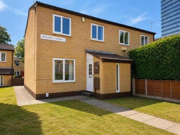 Charming exterior with a bright front lawn....