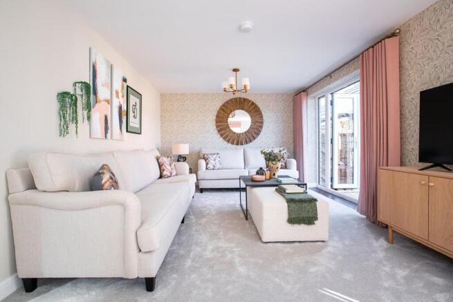The light and spacious lounge features double doors to the garden