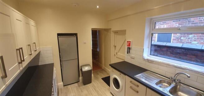 Clean modern kitchen with ample counter space...