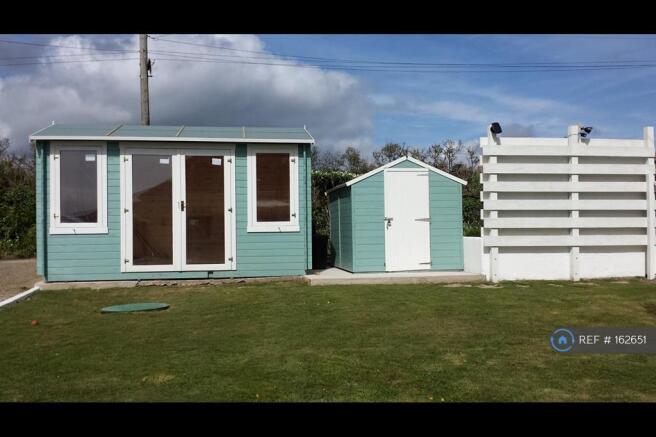 Cabin,Shed And Rear Parking Area