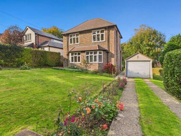 FRONT ASPECT AND DRIVEWAY TO GARAGE