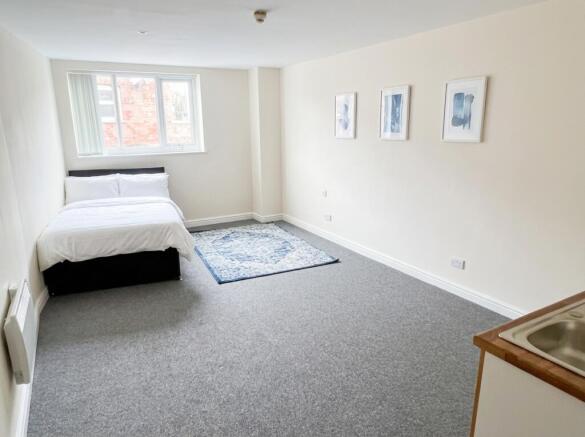 Spacious bright bedroom with ample floor space...