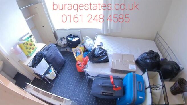 Compact bedroom with neutral décor, wall-mounte...