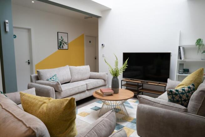 A spacious and inviting living room featuring c...