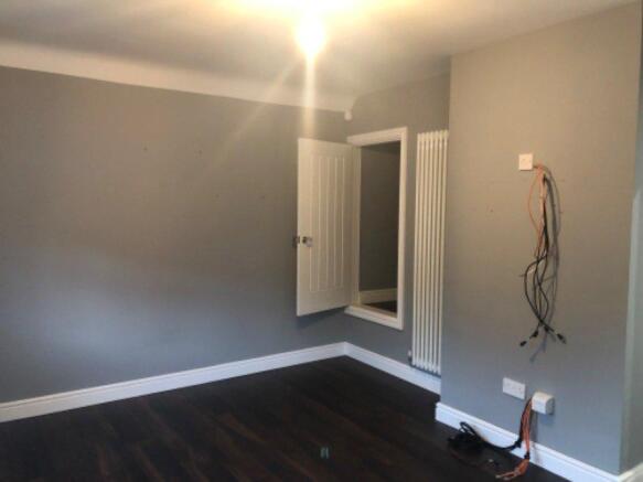 In the right corner is a storage cupboard