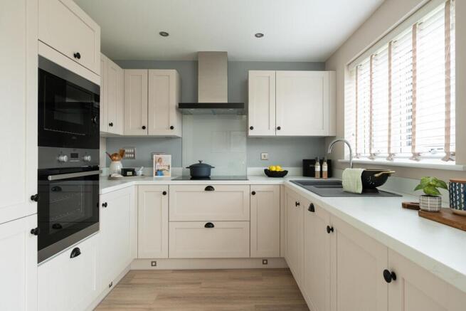 Modern kitchen area with ample storage space