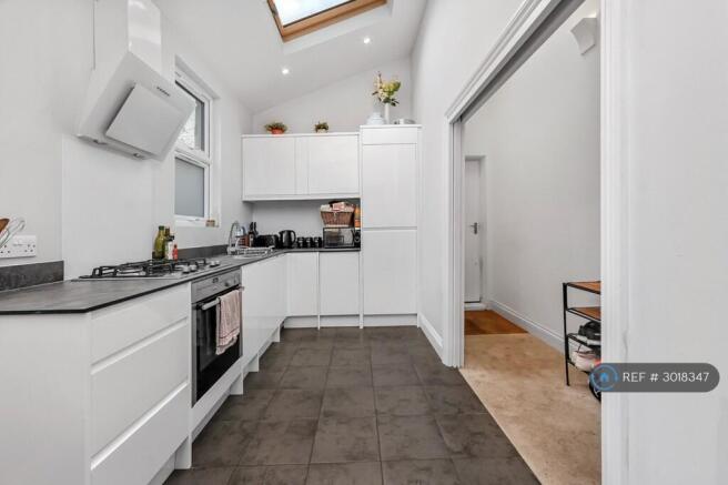 Spacious Kitchen With Oven And Washing Machine