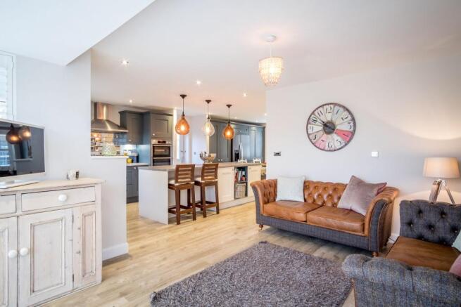 Sitting room open with the kitchen