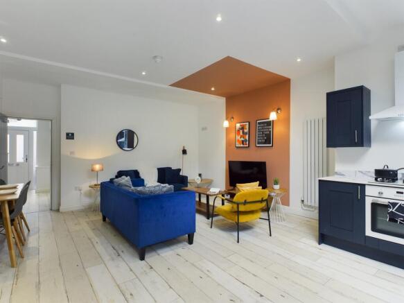 A stylish and spacious modern living room, feat...