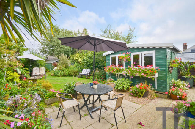 Rear Garden Patio & Chalet.JPG