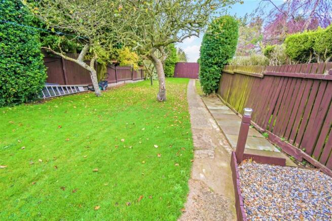 To the rear of the house