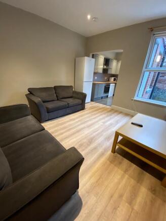 Bright, modern living room with two comfortable...