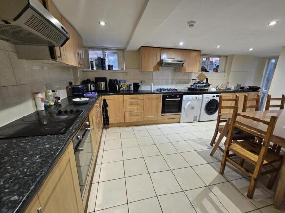 Bright, well-equipped kitchen with ample workto...