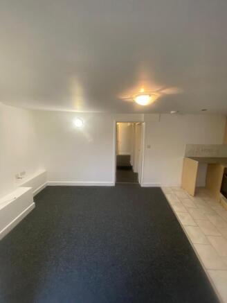 Bright, neutral open-plan living area with fres...