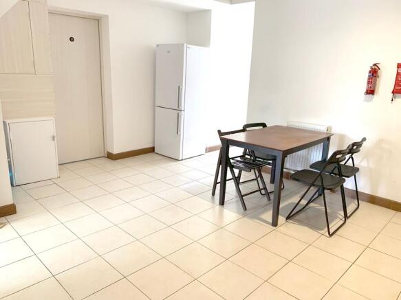 Bright communal lounge area featuring a clean t...