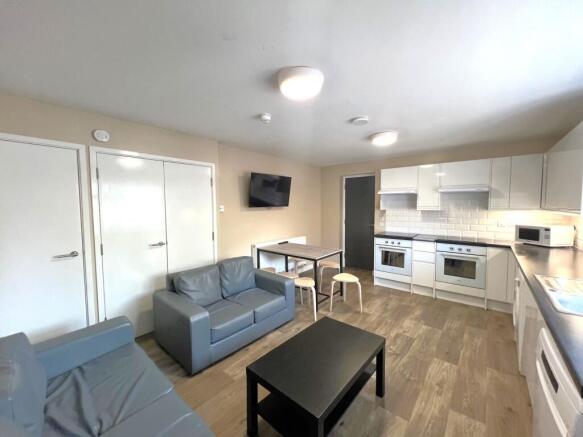 Bright open-plan living area with a modern fitt...