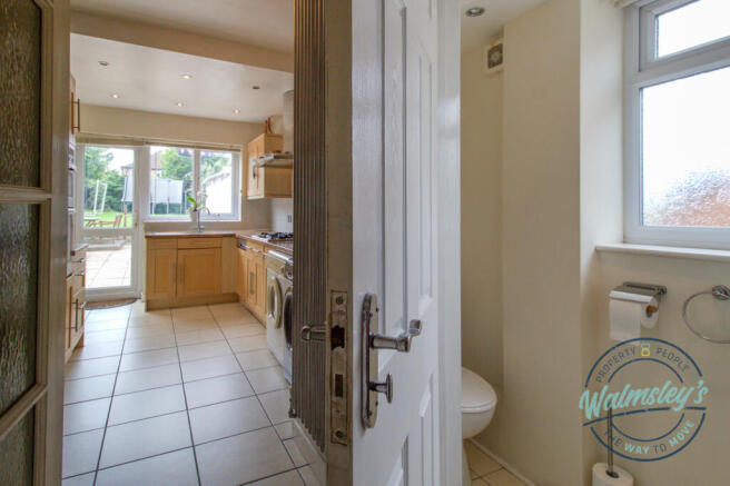 Ground floor cloakroom & kitchen beyond