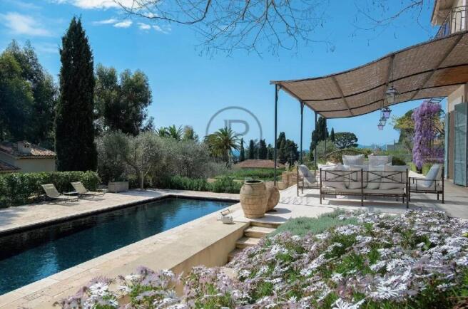 A serene outdoor patio with comfortable seating ov