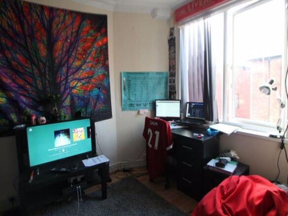 A cozy bedroom featuring a window that brings i...