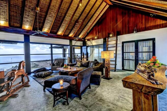 A luxurious, rustic living room with a vaulted cei