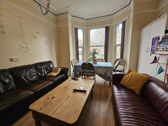 Bright, welcoming living room with bay window, ...