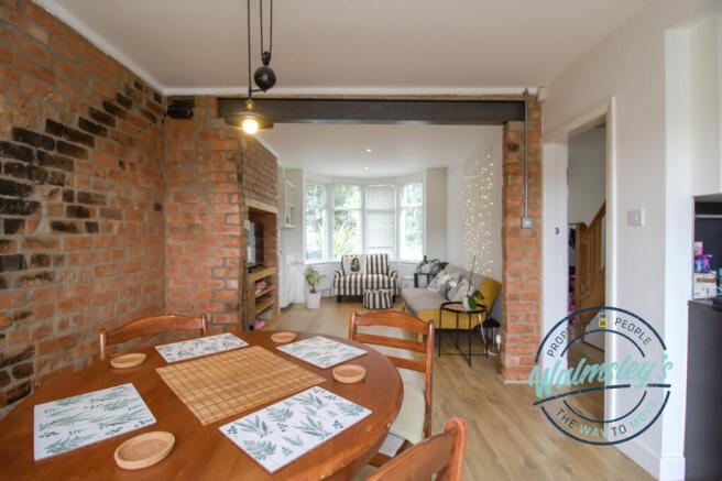 Sitting dining room with exposed brick work