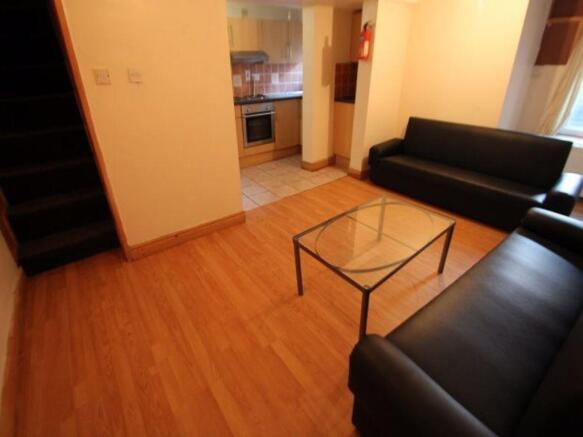 A bright and welcoming living room featuring co...