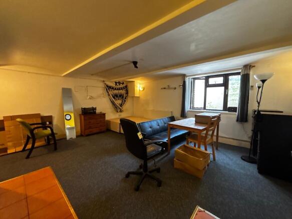 Spacious bedroom with versatile living area...