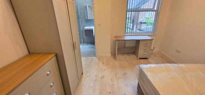 Bright bedroom with ensuite and study desk...