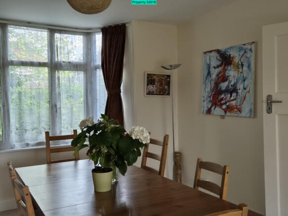 Living/dining room looking towards front garden