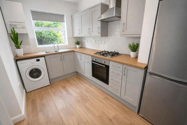Modern fitted kitchen with wood worktops...