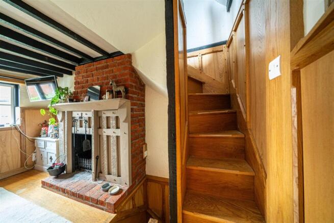 Fireplace and Stairs to bedroom