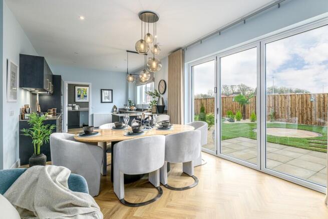 5 bedroom showhome | open plan studio-style kitchen, dining, and family area