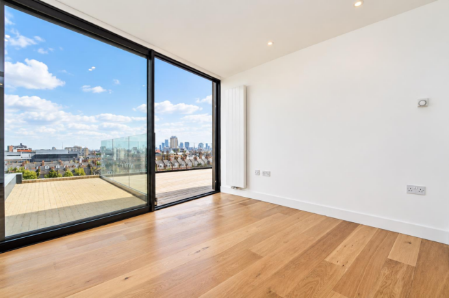 Modern Interior with Rooftop Skyline View.png