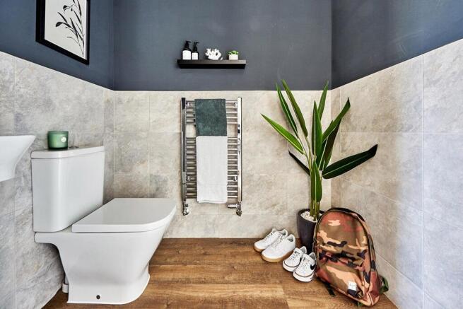 A guest cloakroom completes the ground floor